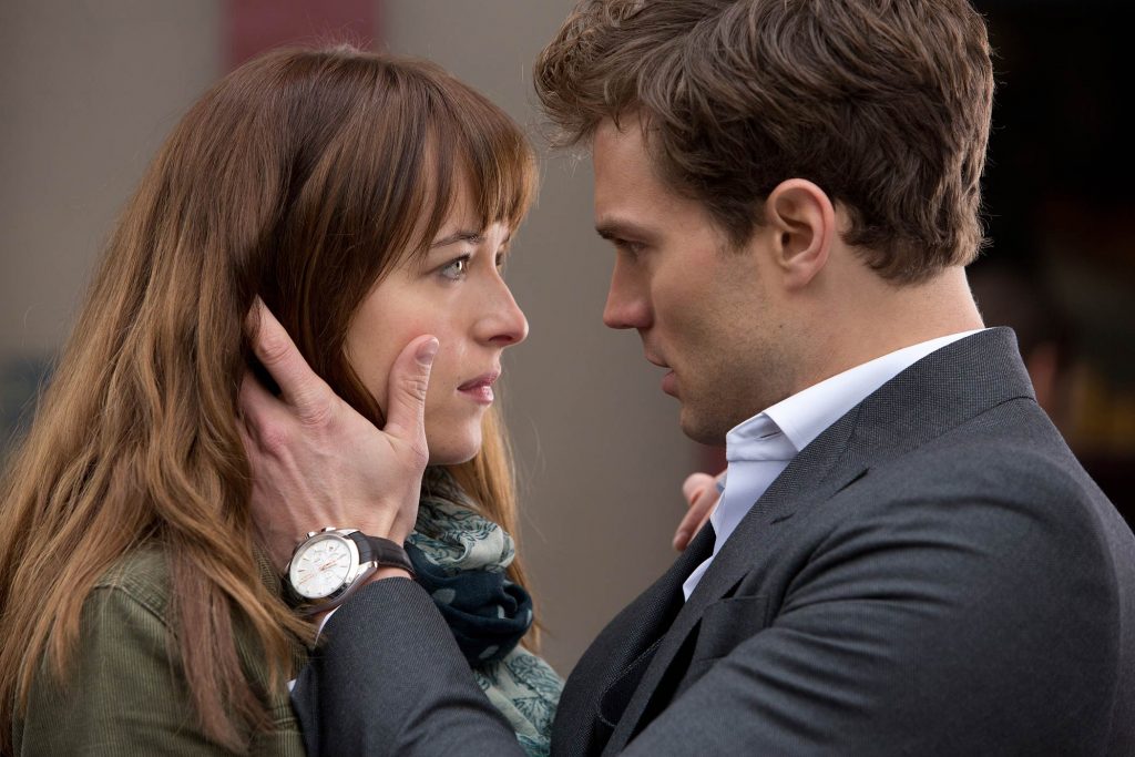 Dakota Fanning and Jamie Dornan in Fifty Shades of Grey