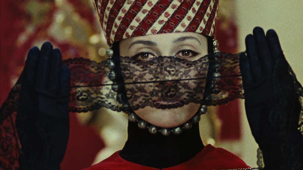 A woman covering her eyes in Sergei Parajanov's 1969 film The Color of Pomegranates.