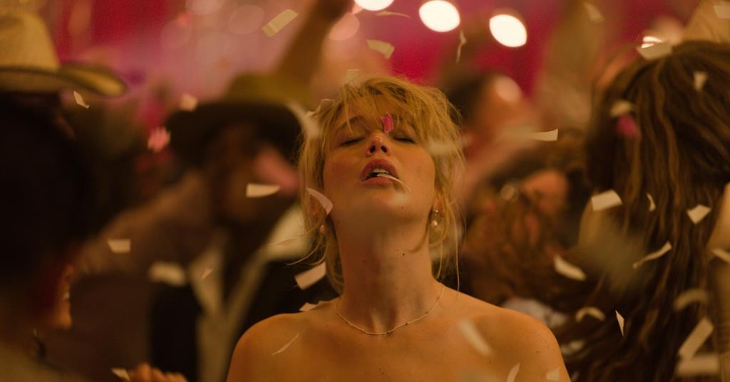 Jennifer Lawrence surrounded by confetti in a party scene from Lynne Ramsay's Die My Love.