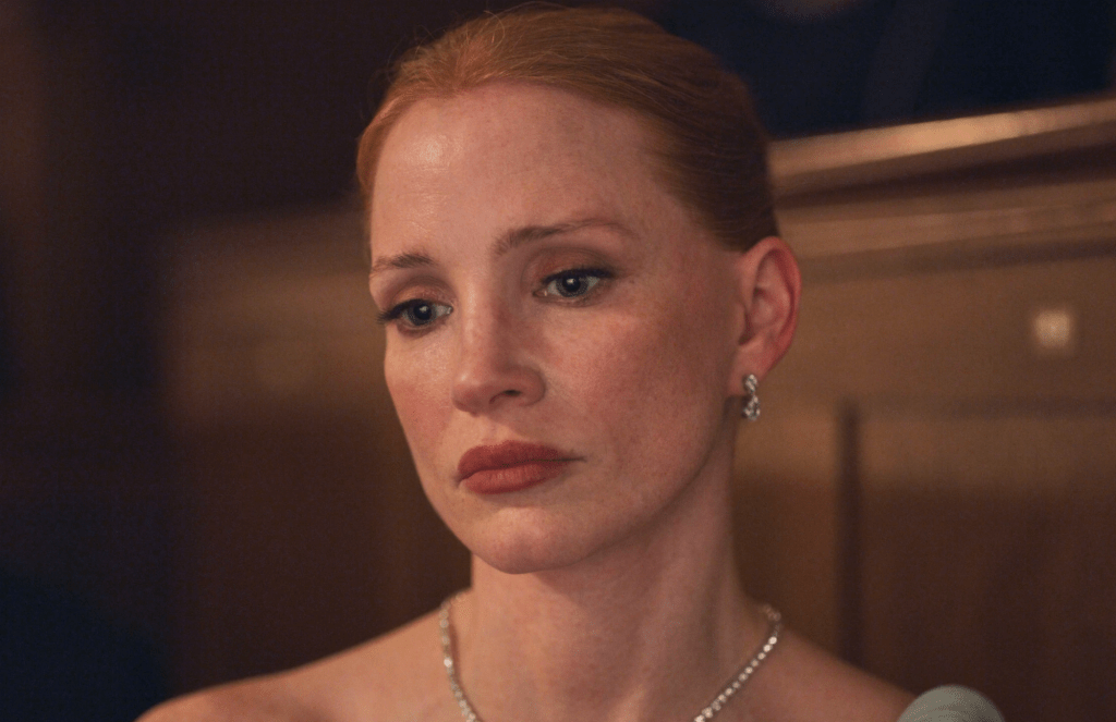 Jessica Chastain looks sad and contemplative in a scene from Dreams (2026).