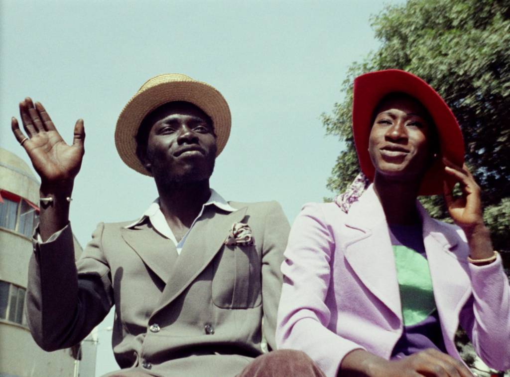 Two Senegalese young adults in fashionable attire in a scene from Touki Bouki (1973)