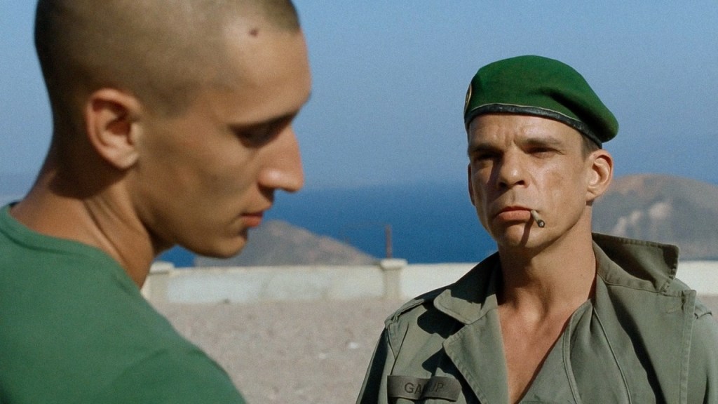 Denis Levant looks at Grégoire Colin in a shot from Beau Travail (1999)